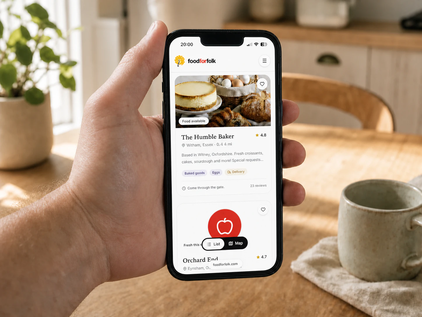 foodforfolk Humble Baker shopfront open on a phone in a warm home kitchen, showing a 4.8 rating and 23 reviews
